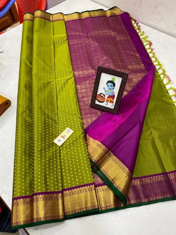 Kanjivaram_Silk_Saree_In_Handloom_Butta_With_Green_with_Purple_Border