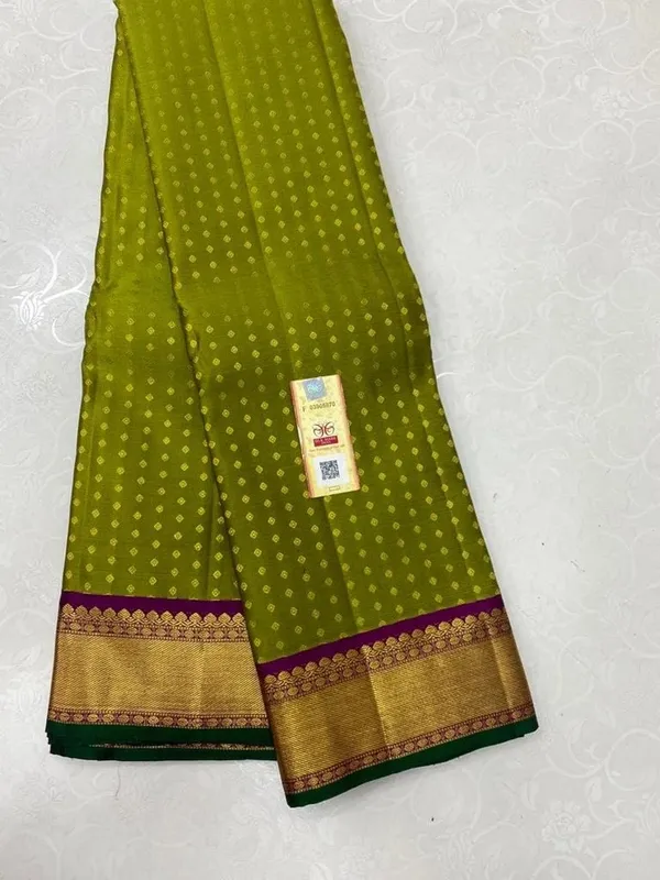 Kanjivaram_Silk_Saree_In_Handloom_Butta_With_Green_with_Purple_Border