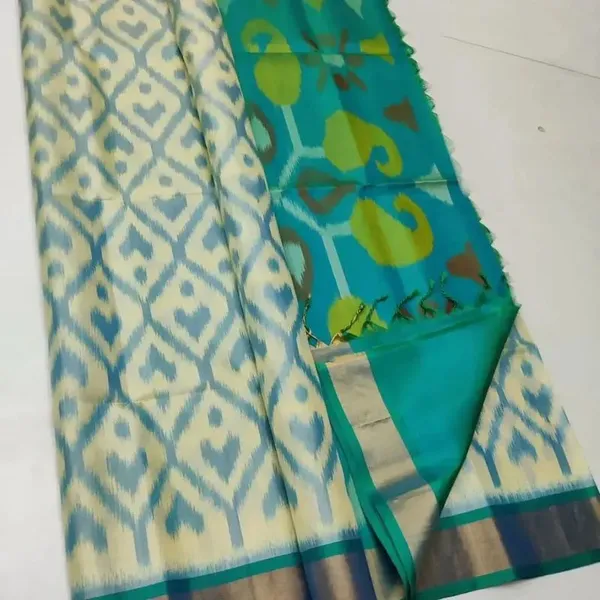 Cream_And_Teal_Green_Ikat_Print_Soft_Silk_Saree_With_Floral_Border