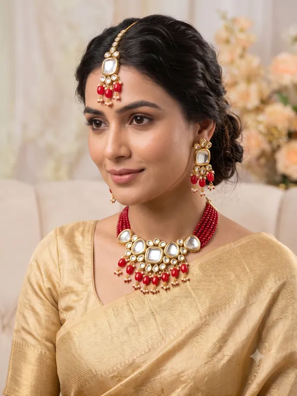 Gold-Plated_Kundan_Choker_Necklace_Set_with_Maang_Tikka_and_Red_Beads