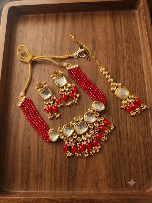 Gold-Plated_Kundan_Choker_Necklace_Set_with_Maang_Tikka_and_Red_Beads