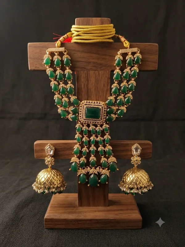 Gold-Plated_Layered_Kundan_Necklace_Set_with_Green_Beads_and_Matching_Jhumkas