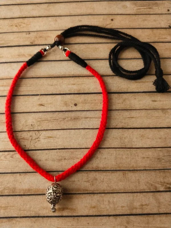 Oxidised_Metal_Ball_Pendant_In_Red_Thread