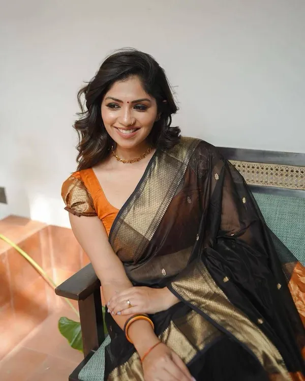 Designer_Black_Orange_Saree_with_Golden_Woven_Motifs_&_Rich_Border