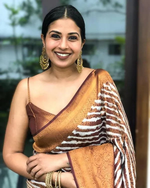 Elegant_Brown_Woven_Saree_with_Floral_Jacquard_Border_&_Striped_Designer_Pallu