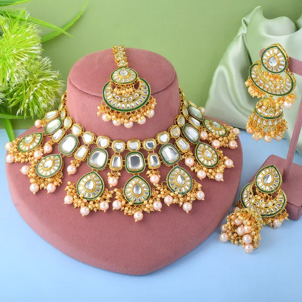Elegant_Gold_Kundan_Necklace_Set_With_Jhumka_Earrings_&_Maang_Tikka_For_Weddings_&_Festive_Occasions