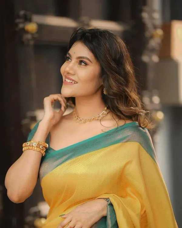Elegant_Mustard_Yellow_Soft_Lichi_Silk_Saree_with_Teal_Woven_Border