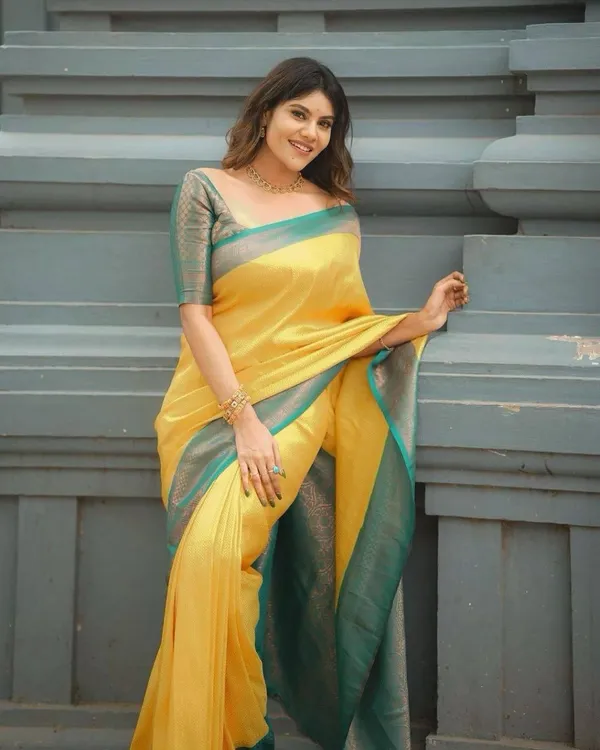 Elegant_Mustard_Yellow_Soft_Lichi_Silk_Saree_with_Teal_Woven_Border