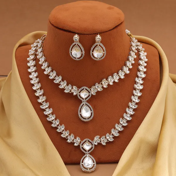 Elegant_White_Kundan_Necklace_Set_with_Leaf_Motif_&_Stone_Studded_Earrings_–_Wedding_&_Festive_Jewellery