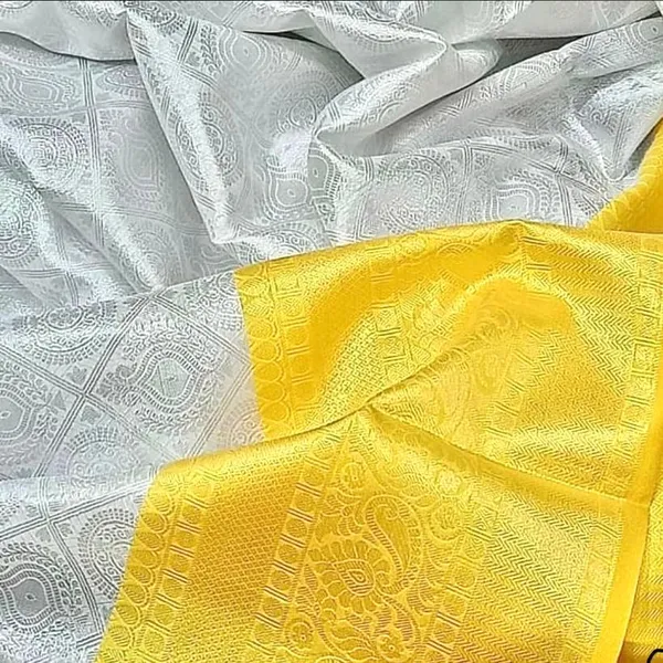 Elegant_White_&_Yellow_Soft_Lichi_Silk_Saree_with_Rich_Jacquard_Pallu_and_Border