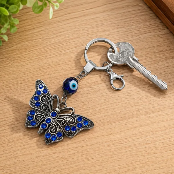 Blue_Metal_Crystal_Stone_Evil_Eye_Butterfly_Keychain_Bag_Charm_And_Blue_Silver_Metal_Evil_Eye_Ganesha_Keychain_For_Men_Women_|_Pack_Of_2