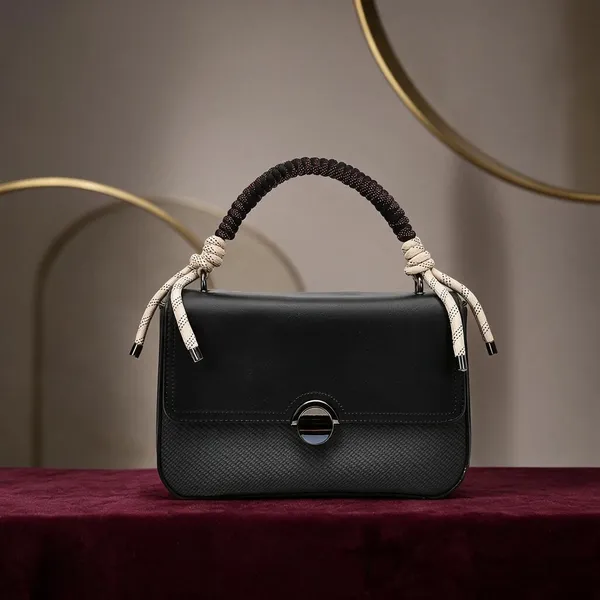 Evara_Black_Textured_Handbag_With_Braided_Handle