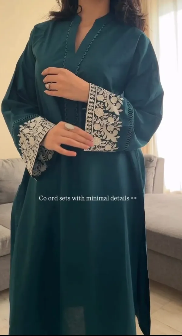 Teal_Embroidered_Kurta_With_Matching_Trousers_For_Women