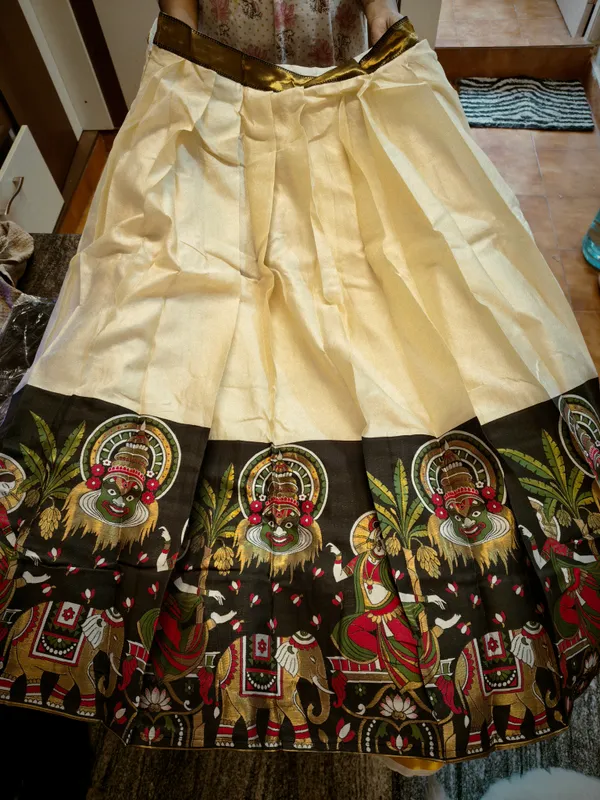 Cream_Silk_Kathakali_Print_Pleated_Dhavani_Set_With_Unstiched_Blouse_For_Women