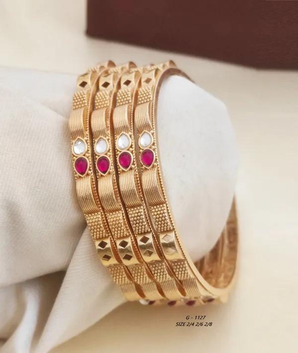 Textured_Bangles_With_Ruby_And_Pearl_Embellishments