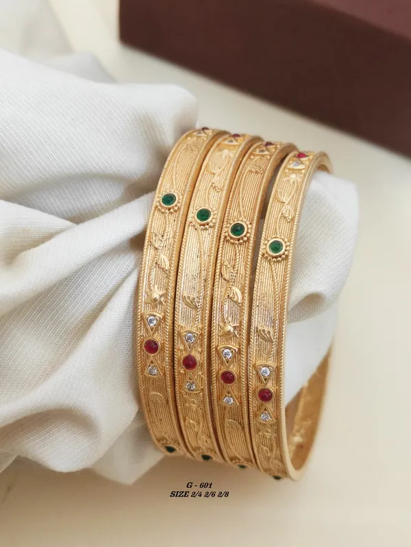 Gold_Textured_Bangles_Set_With_Green_And_Red_Stone_Embellishments