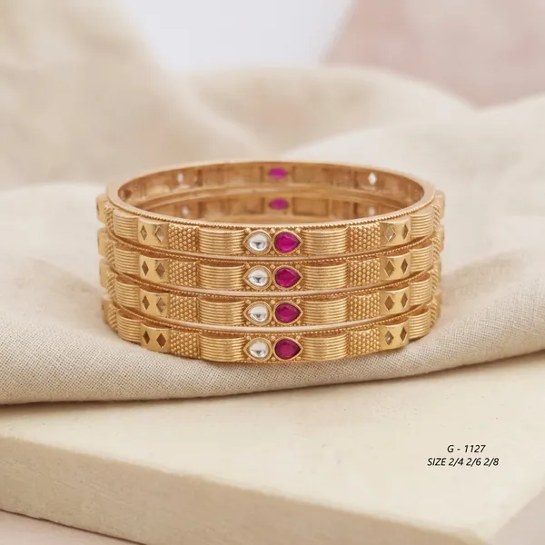 Textured_Bangles_With_Ruby_And_Pearl_Embellishments