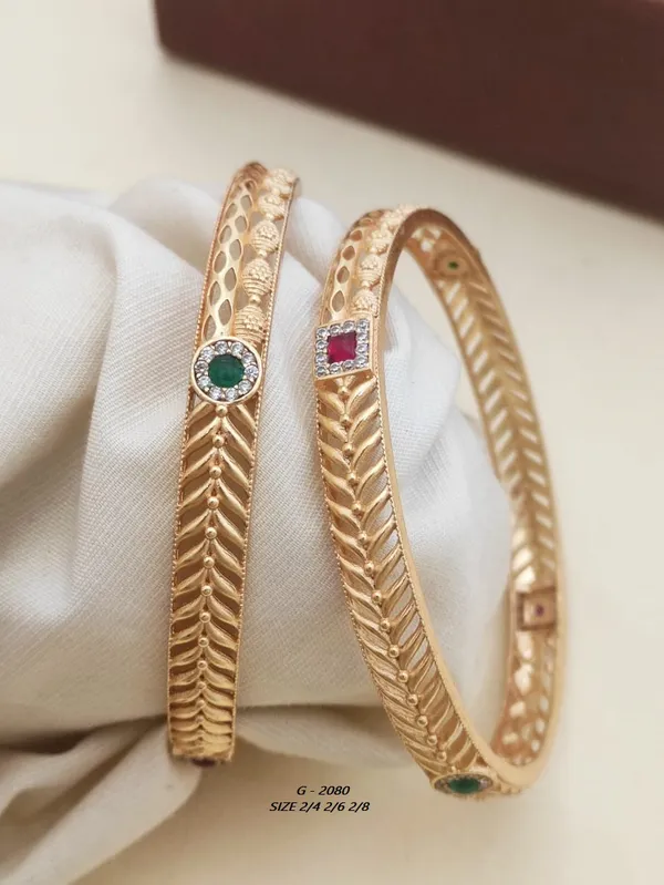 Textured_Bangles_With_Green_And_Pink_Stone_Accents