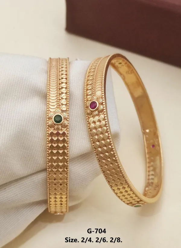 Gold_Textured_Bangles_With_Gemstone_Accents_For_Women