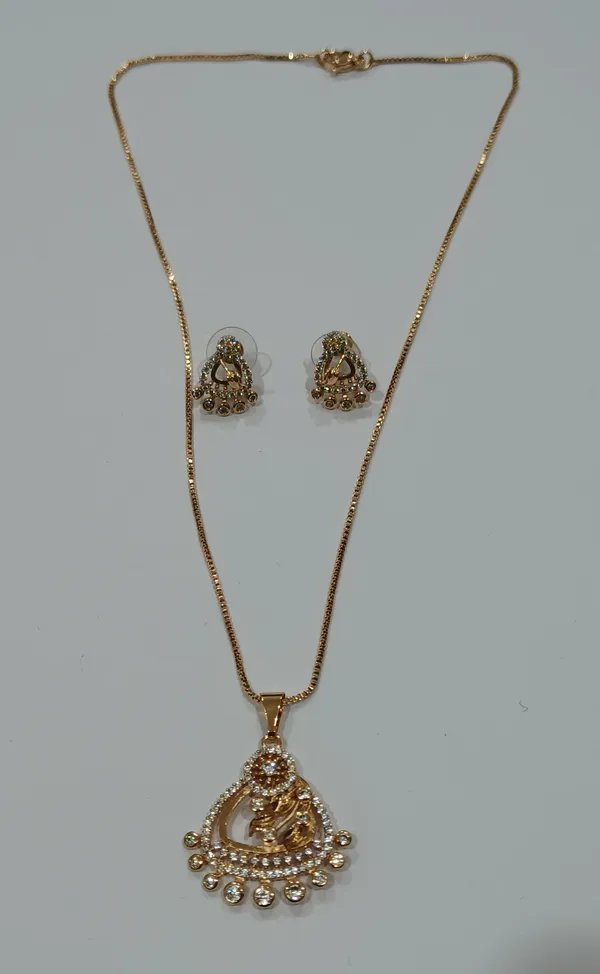 Gold_Tone_Crystal_Studded_Peacock_Pendant_Necklace_With_Matching_Earrings