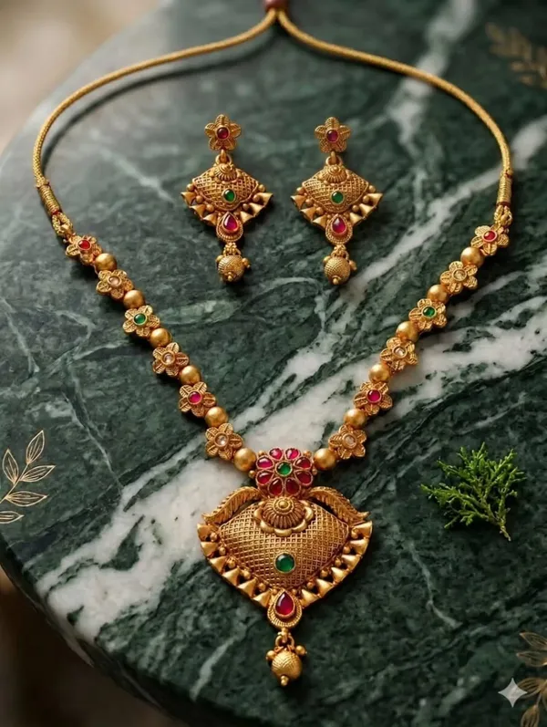 Traditional_Gold-Tone_Kundan_Necklace_Set_with_Ruby_&_Green_Stone_Pendant_and_Matching_Earrings