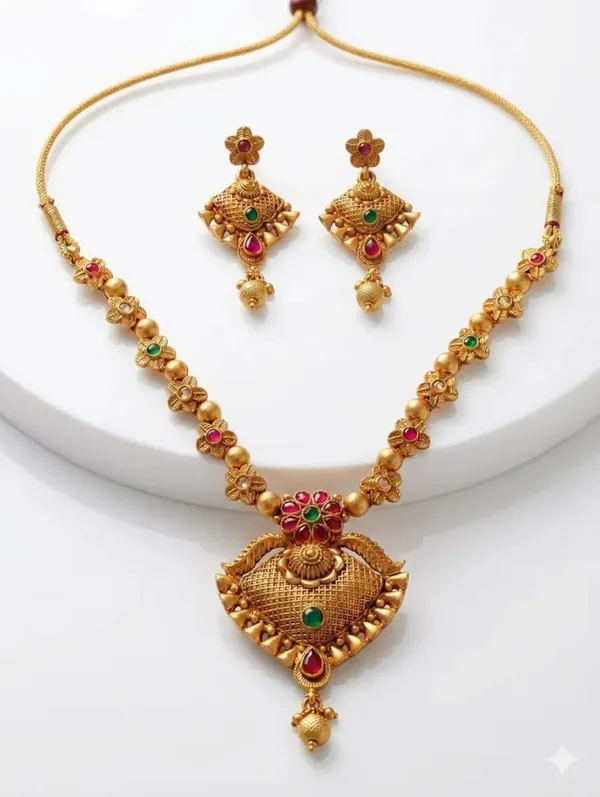 Traditional_Gold-Tone_Kundan_Necklace_Set_with_Ruby_&_Green_Stone_Pendant_and_Matching_Earrings
