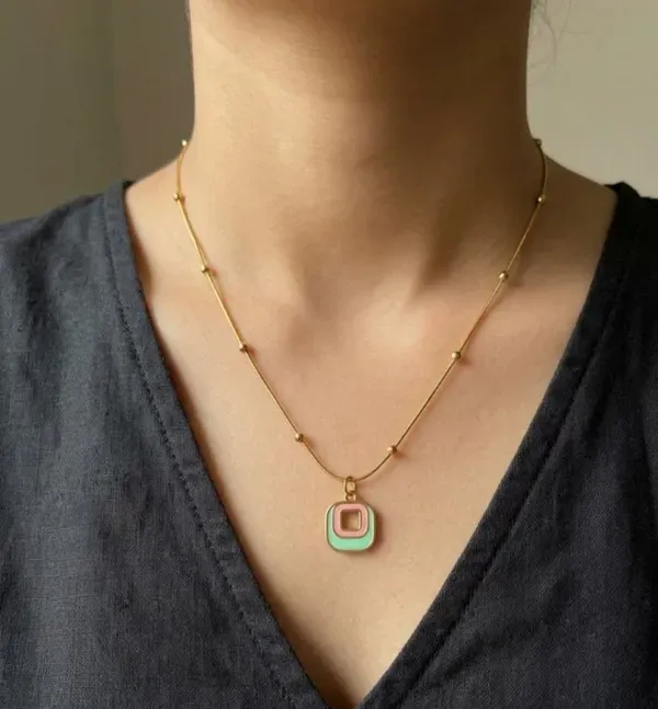 Gold_Plated_Geometric_Pendant_Necklace_With_Green_And_Pink_Enamel