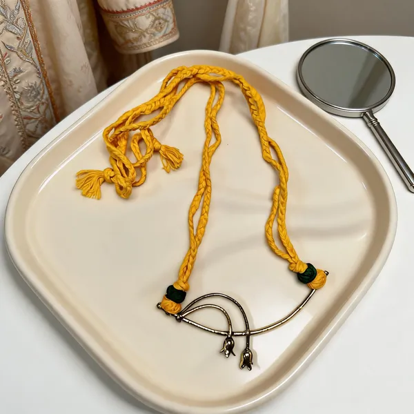 Golden_Yellow_Brass_Dokra_Flower_Pendant_Yellow_Braided_Thread_Necklace_and_Earings