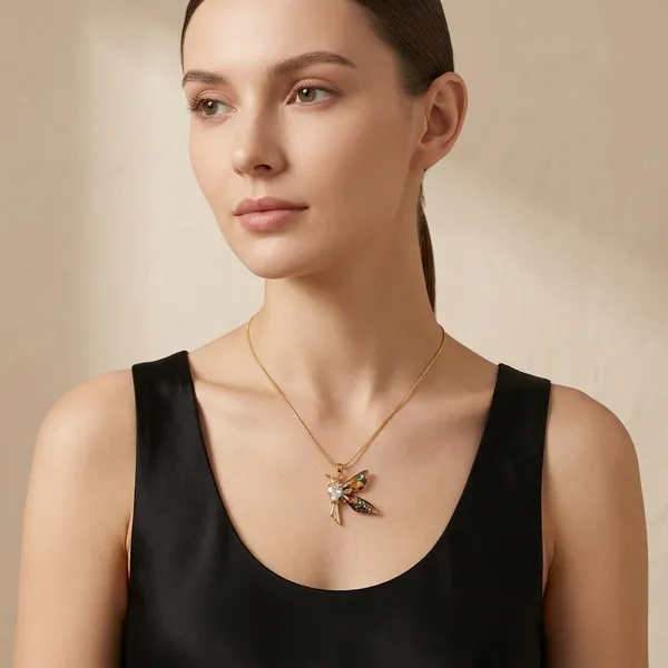 Hummingbird_Pendant_With_A_Heart-Shaped_Crystal_Body_And_Iridescent_Enamel_Wings.