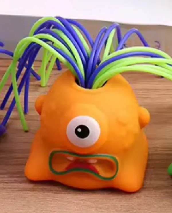 Orange_Rubber_Monster_Squeeze_Sound_Toy_With_Colorful_Hair