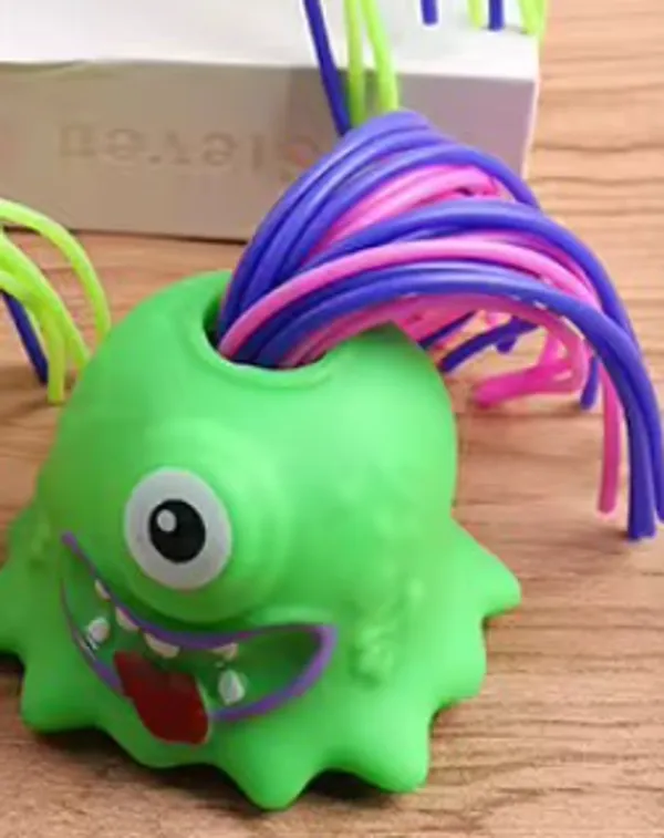 Green_Monster_Soft_Rubber_Squeeze_Toy_With_Colorful_Hair