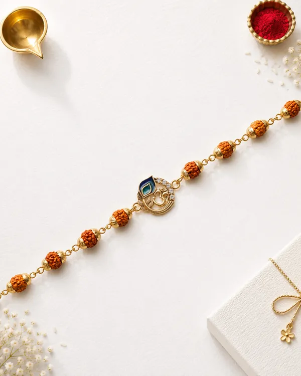 Golden_Rudraksha_Om_Rakhi_With_Beads_And_Peacock_Pendant_(Pack_Of_3)