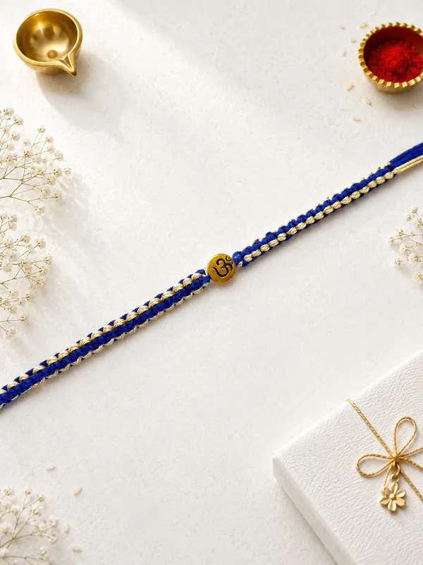 Blue_Thread_Rakhi_With_Golden_Om_Charm_(Pack_Of_9)