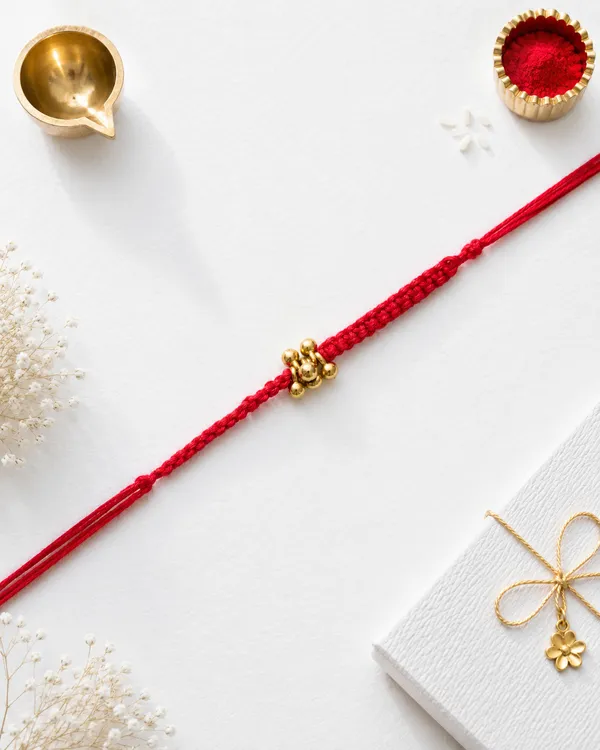 Gold_Rakhi_With_Red_Thread_For_Raksha_Bandhan_(Pack_Of_11)