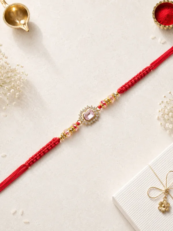 Red_Thread_Rakhi_With_Pink_Stone_And_Golden_Beads_(Pack_Of_4)