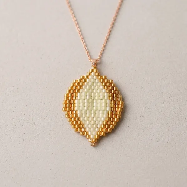 Gold_Ivory_Beaded_Leaf_Pendant_Necklace_And_Earrings_Set_For_Women