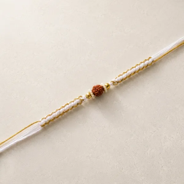 Handcrafted_Rakhi_With_Rudraksha_Bead_And_Pearl_Accents_(Pack_Of_7)