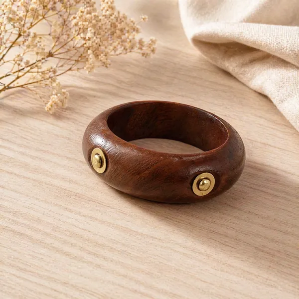 Elegant_Handcrafted_Wooden_Bangle_with_Brass_Stud_Accents