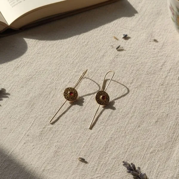 Rivah_vibrant_floral_centerpiece_and_its_exceptionally_long,_slender_gold-toned_pin_Metal_Drops_&_Danglers_()