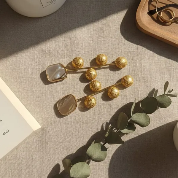 Rivah_Highlighting_the_golden_radial_design_and_the_unique_stone_in_between_feature_Metal_Drops_&_Danglers_()