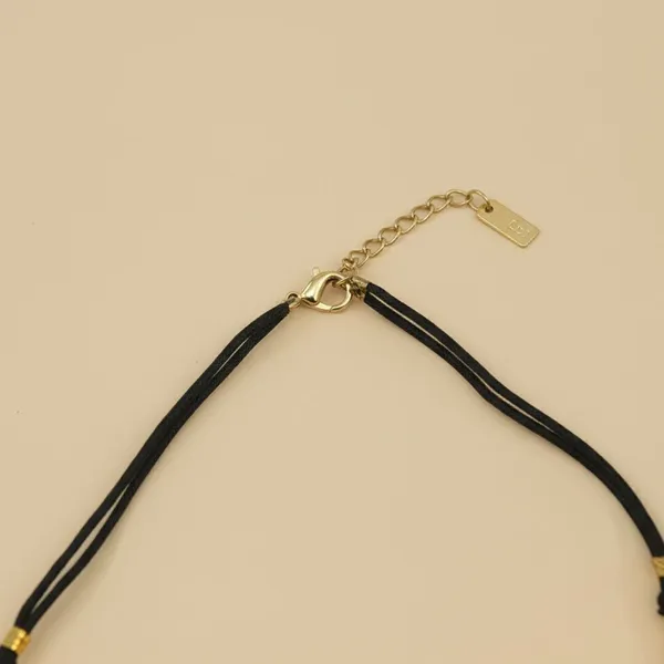 Rivah_Gold-Tone_Metal_Crest_Dori_Necklace_for_Women_|_Black_Cord_Adjustable_Dori_Necklace_()