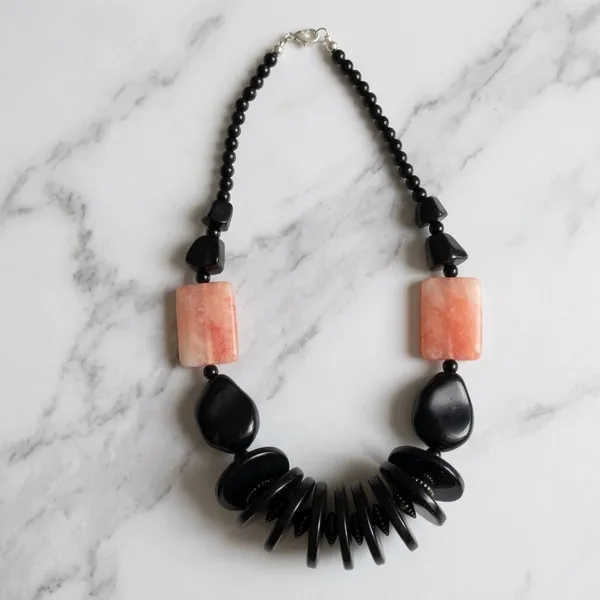 Black_Beaded_Necklace_With_Red-Orange_Stone_Accents_Dori_Necklace