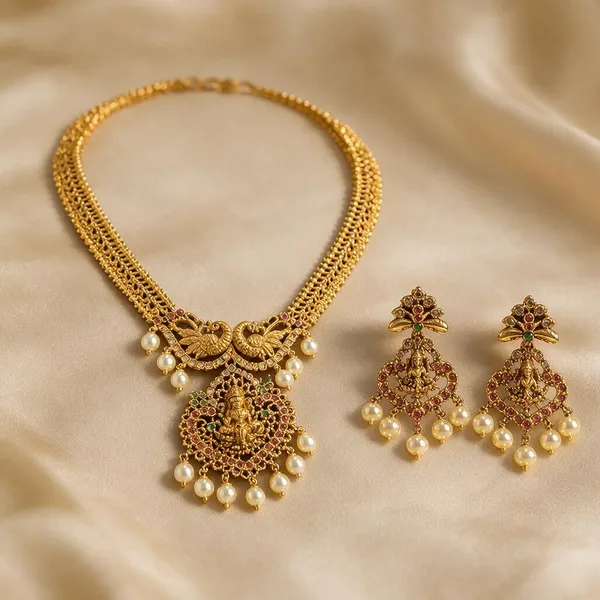 Gold-Tone_Temple_Jewellery_Set_–_Peacock_&_Goddess_Lakshmi_Pendant_Necklace_with_Pearl_Drop_Earrings