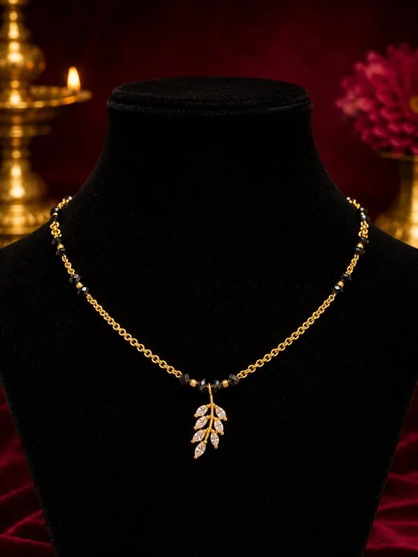 Gold-Plated_Black_Bead_Mangalsutra_Necklace_with_Kundan_Leaf_Pendant