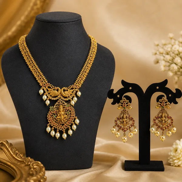Gold-Tone_Temple_Jewellery_Set_–_Peacock_&_Goddess_Lakshmi_Pendant_Necklace_with_Pearl_Drop_Earrings