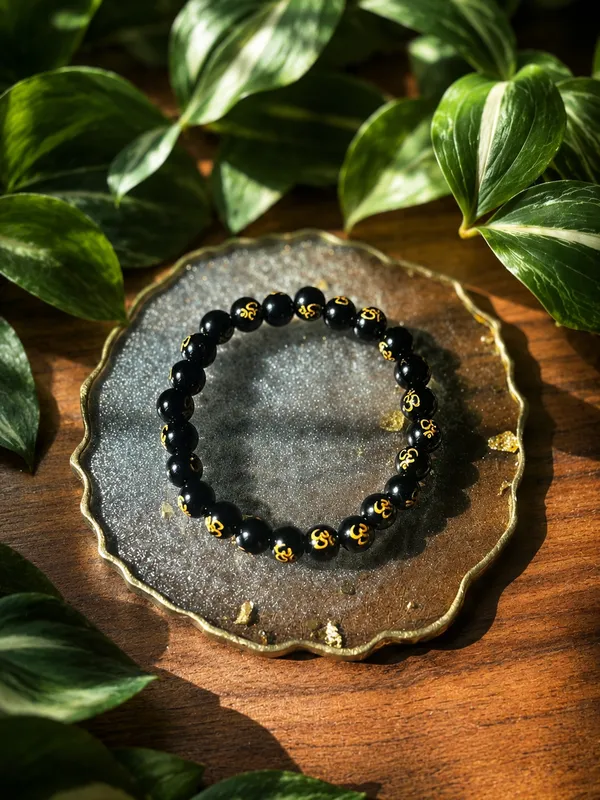 Black_Tourmaline_With_Om_Bracelet_With_Free_Selenite_Tumble