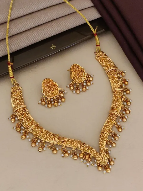 Gold_Alloy_Floral_Paisley_Pearl_Drop_Necklace_Set_With_Earrings