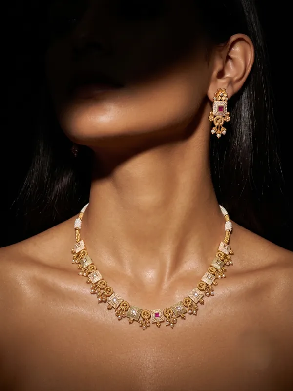 Gold_Alloy_Elephant_Motif_Pink_Stone_Necklace_Set_For_Women