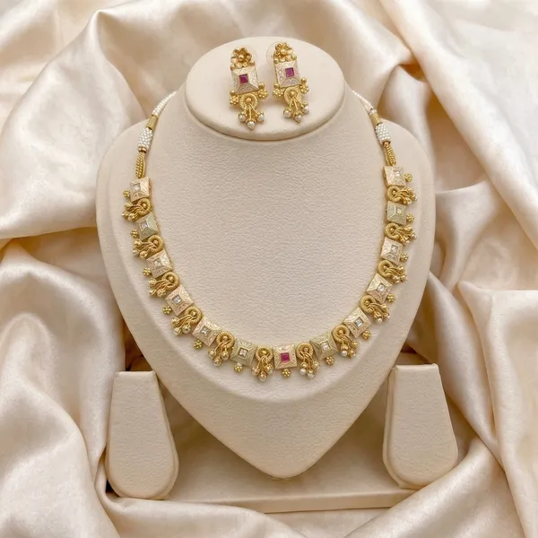 Gold_Alloy_Elephant_Motif_Pink_Stone_Necklace_Set_For_Women