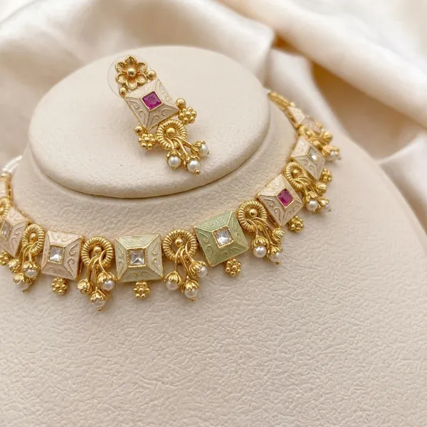 Gold_Alloy_Elephant_Motif_Pink_Stone_Necklace_Set_For_Women